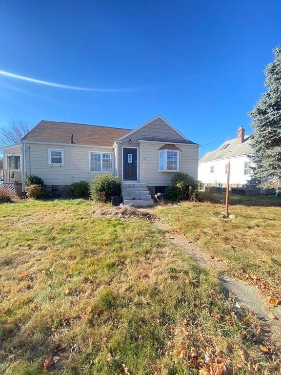 ranch-style home with a front yard