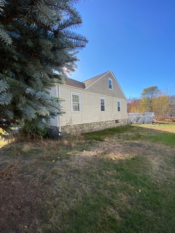 view of home's exterior with a lawn