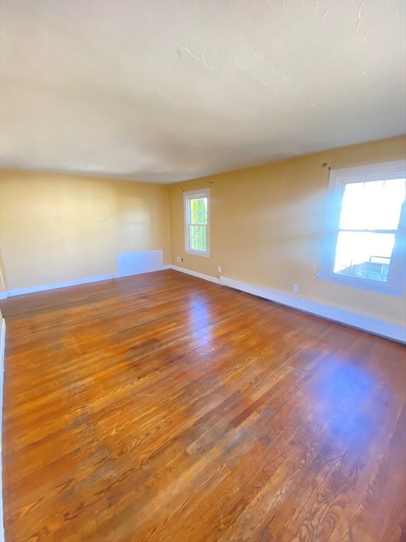 empty room featuring hardwood / wood-style flooring