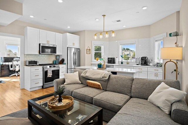 35 Somerset Ave # 6, Winthrop, MA 02152 - living room featuring light wood-style flooring and recessed lighting