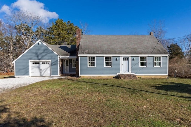 view of front of house with a front yard and a garage