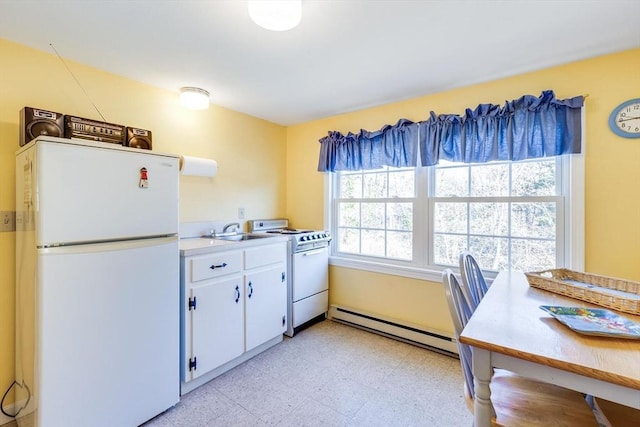 kitchen with white cabinets, white appliances, a baseboard heating unit, and sink