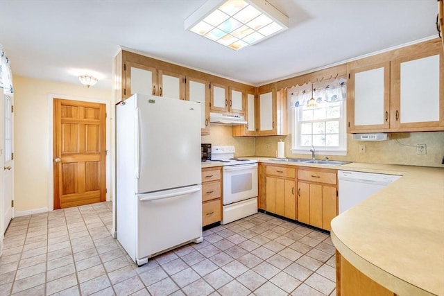 kitchen with light tile patterned flooring, white appliances, and sink