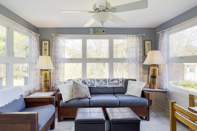 sunroom featuring a wealth of natural light and ceiling fan