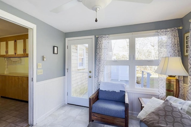 entryway with ceiling fan and a wealth of natural light