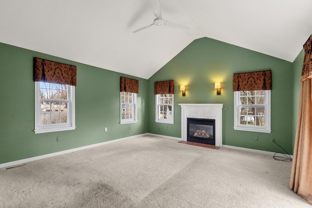 unfurnished living room featuring carpet flooring, ceiling fan, and lofted ceiling