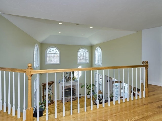 hallway with recessed lighting, baseboards, and wood finished floors