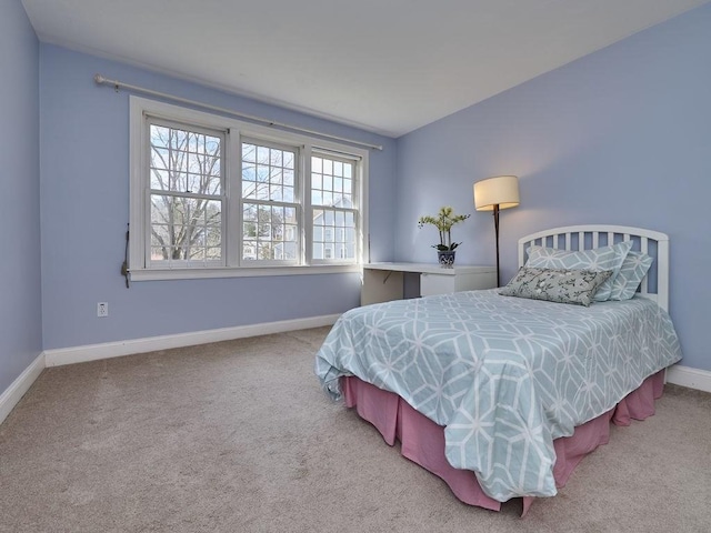 bedroom with carpet and baseboards