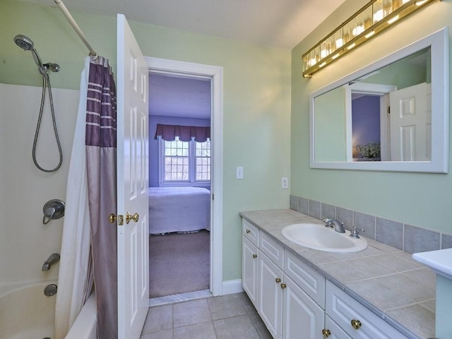 bathroom with baseboards, shower / bath combination with curtain, vanity, and tile patterned flooring