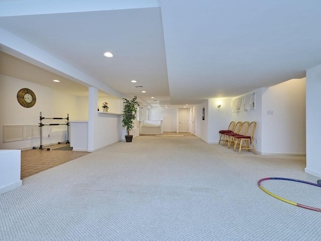 interior space featuring recessed lighting, baseboards, and carpet