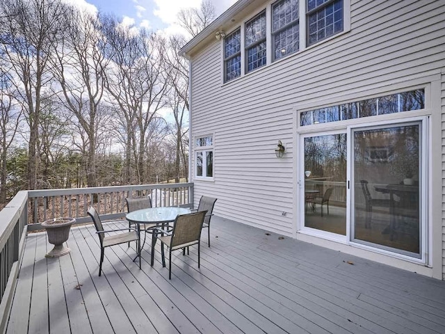 wooden deck featuring outdoor dining space