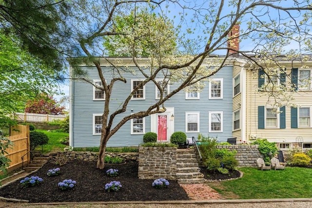 159 Elm St Unit 2, Marblehead, MA 01945 - view of front of house featuring a chimney and fence