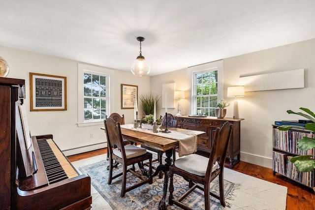 159 Elm St Unit 2, Marblehead, MA 01945 - dining room with baseboard heating, healthy amount of natural light, wood finished floors, and baseboards