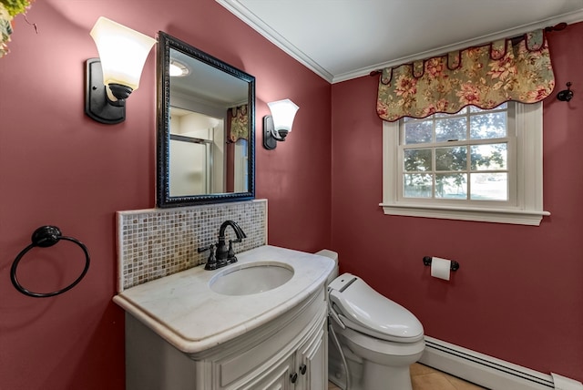 bathroom featuring a baseboard radiator, toilet, vanity, crown molding, and decorative backsplash