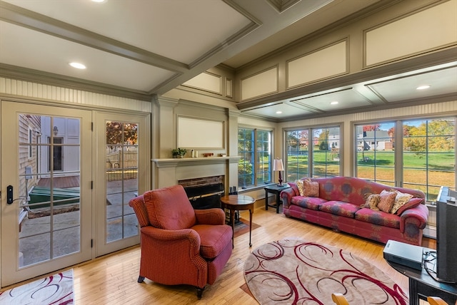 sunroom featuring beamed ceiling and coffered ceiling