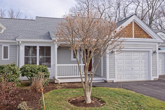 view of front of home with covered porch and a garage