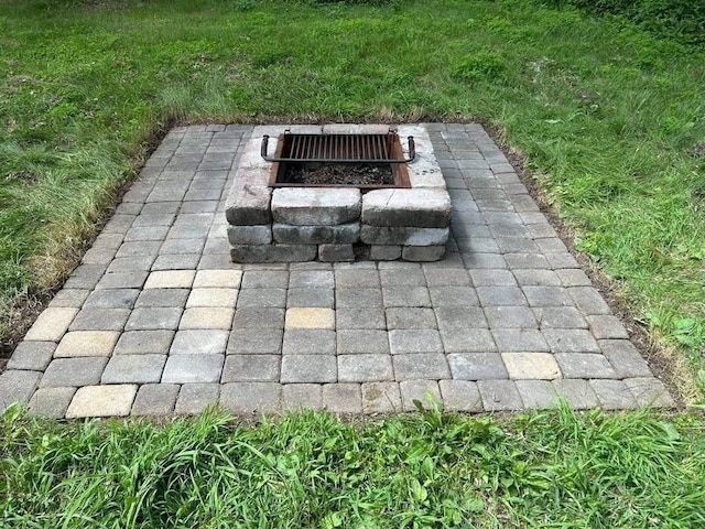 exterior details featuring an outdoor fire pit