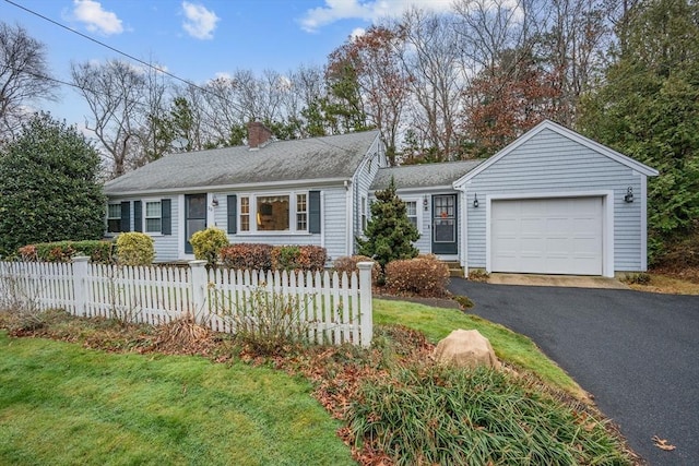 ranch-style home with a front yard and a garage