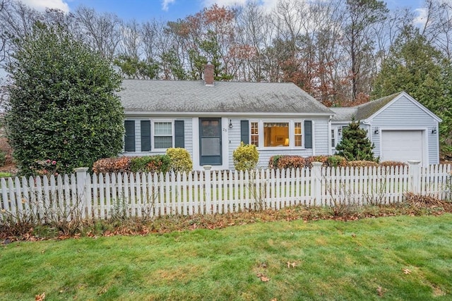 ranch-style home with a garage and a front yard