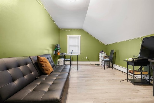 bonus room with baseboard heating, light hardwood / wood-style flooring, and vaulted ceiling