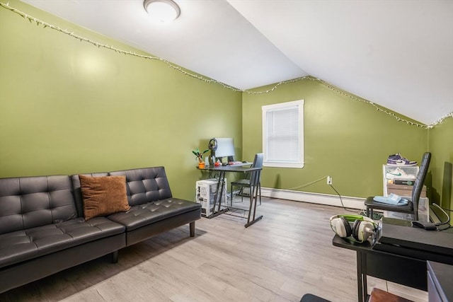 living room featuring light hardwood / wood-style floors, baseboard heating, and vaulted ceiling