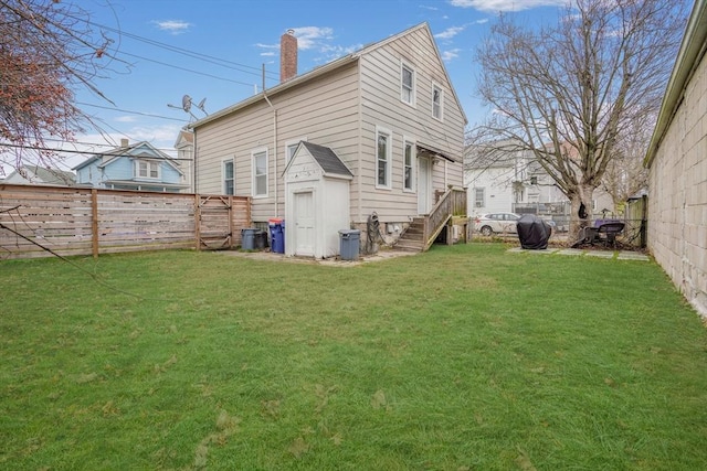 rear view of house with a lawn