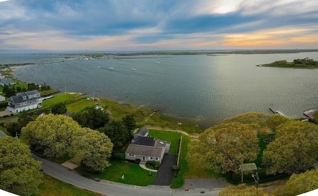 aerial view at dusk with a water view