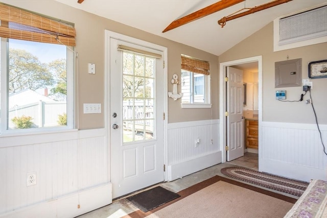 entryway with lofted ceiling with beams and electric panel