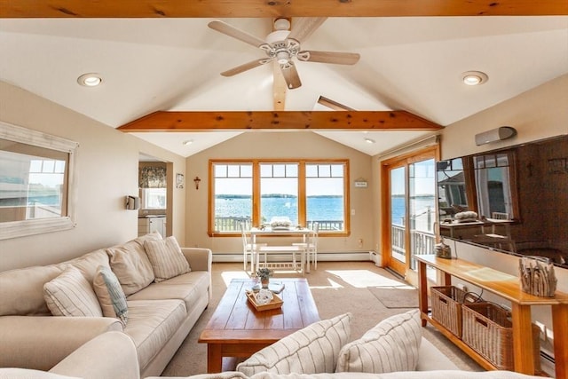 living room with vaulted ceiling with beams, a water view, ceiling fan, and light colored carpet