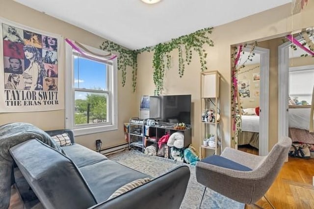 living area with baseboard heating