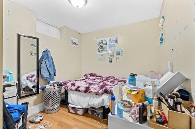 bedroom with wood finished floors