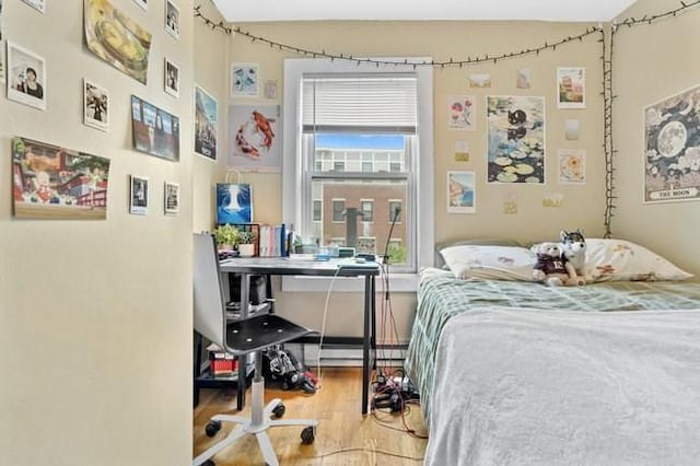 bedroom featuring wood finished floors