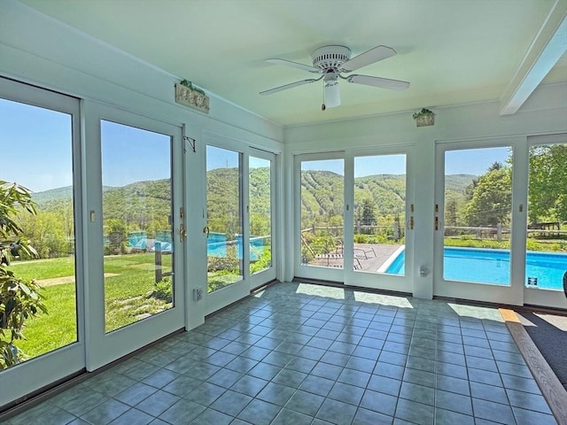 85 Warfield Rd, Charlemont, MA 01339 - unfurnished sunroom with healthy amount of natural light, tile patterned flooring, and a mountain view