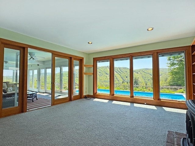 85 Warfield Rd, Charlemont, MA 01339 - unfurnished sunroom with carpet and recessed lighting