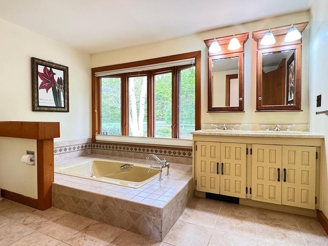 85 Warfield Rd, Charlemont, MA 01339 - bathroom with a bath, double vanity, tile patterned floors, and baseboards