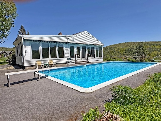 85 Warfield Rd, Charlemont, MA 01339 - rear view of house featuring a patio, an outdoor pool, and entry steps