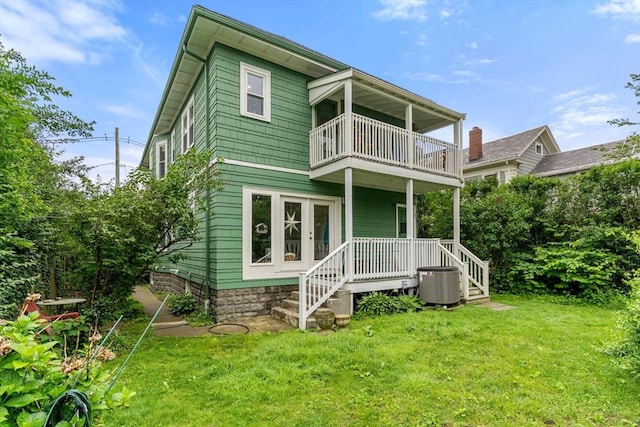 57 Atherton St Unit 57, Somerville, MA 02143 - rear view of property featuring a balcony, a lawn, french doors, and a porch