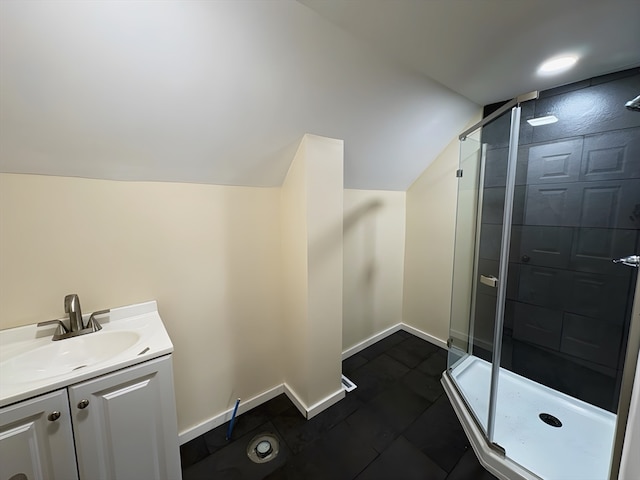 bathroom featuring walk in shower, tile patterned flooring, vanity, and lofted ceiling