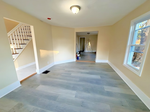 empty room with wood-type flooring