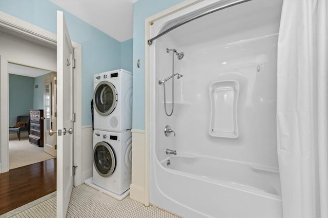 116 Rantoul St Unit 503, Beverly, MA 01915 - ensuite bathroom with stacked washer / dryer, shower / tub combo, and tile patterned floors