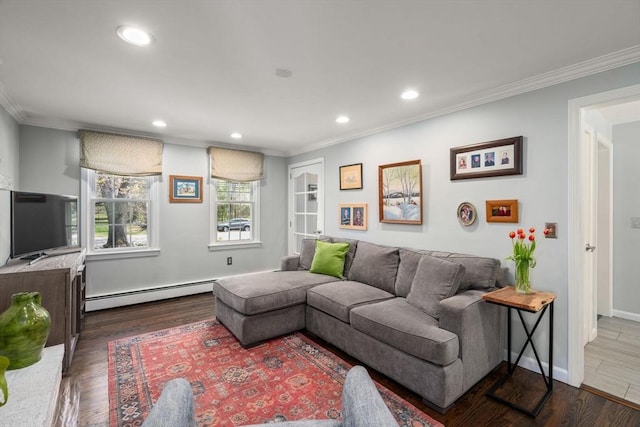living room with ornamental molding, a baseboard radiator, and recessed lighting