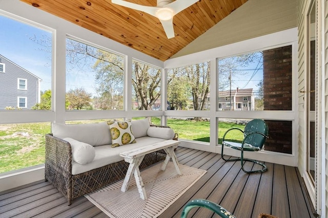 sunroom featuring an outdoor hangout area and a ceiling fan