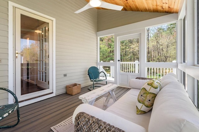 sunroom / solarium featuring a ceiling fan and an outdoor hangout area
