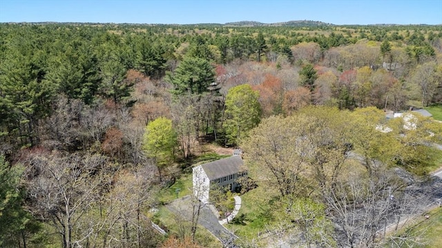 aerial view with a wooded view