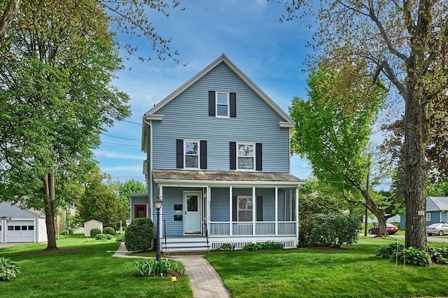 view of front facade featuring a front lawn, a porch, and a garage