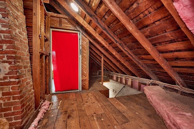 attic featuring an upstairs landing