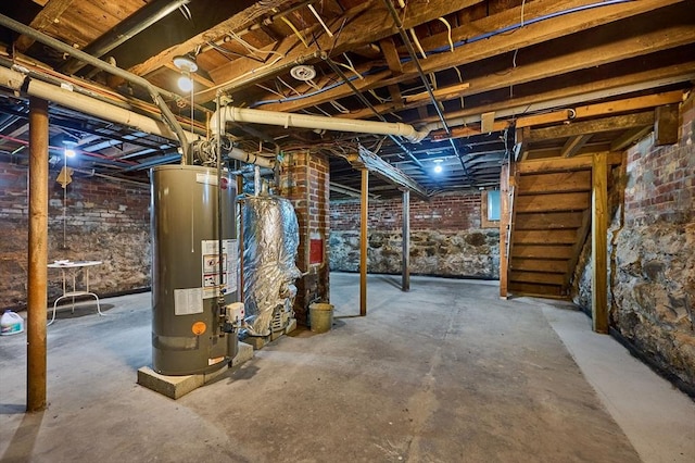 unfinished below grade area featuring gas water heater
