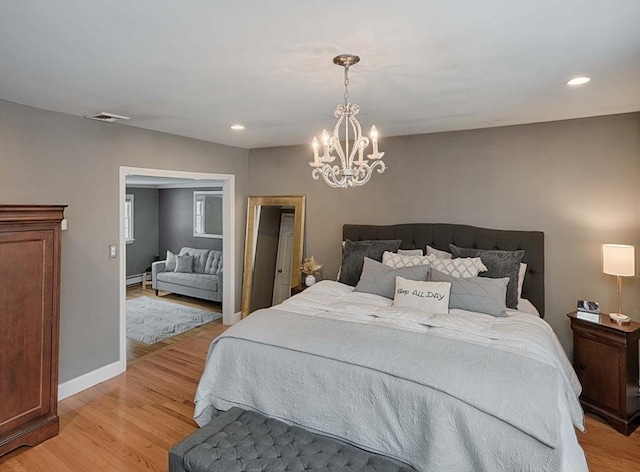 bedroom with baseboards, recessed lighting, visible vents, and light wood-style floors