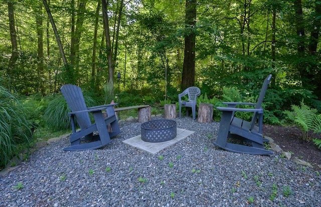 view of yard with an outdoor fire pit