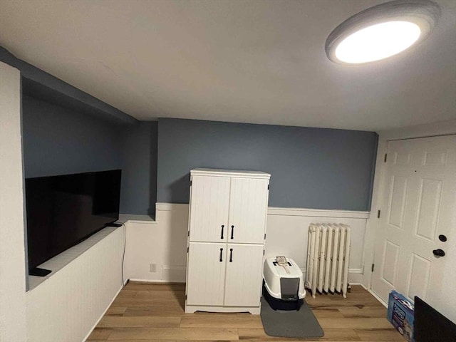 44 Cherry St Unit 2, Swampscott, MA 01907 - recreation room with radiator, light wood finished floors, and wainscoting